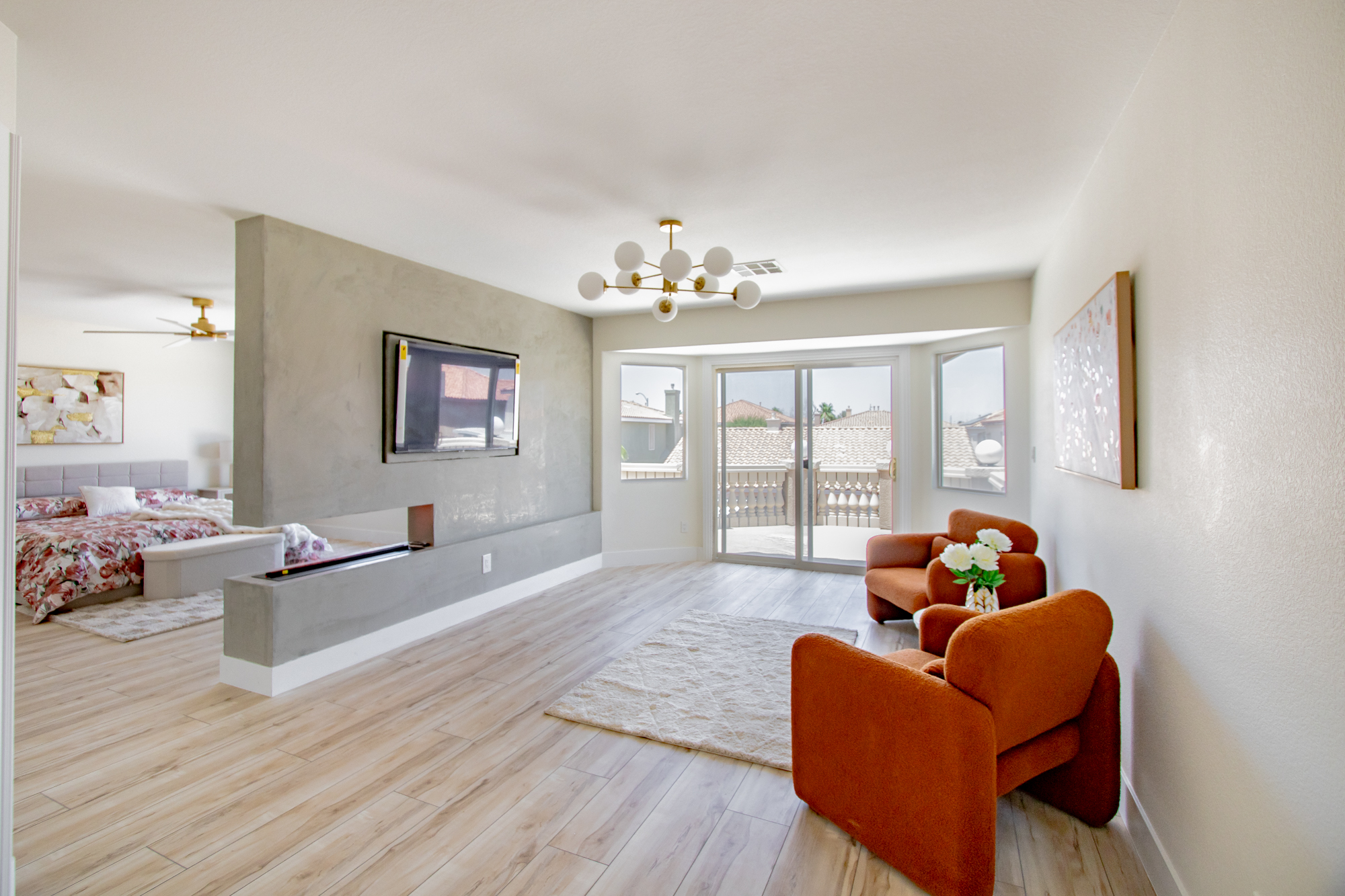 Interior renovation with new wood-look flooring and an open living space by Nevada Pro Construction
